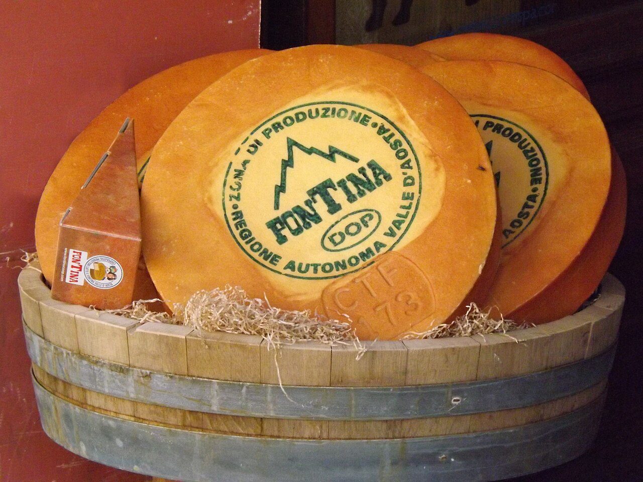 A wheel of Fontina cheese